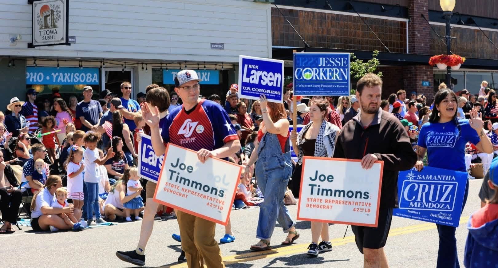 Whatcom Democrats volunteers marching with candidate signs